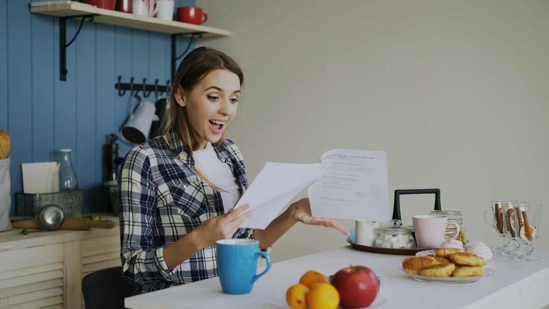 person reviewing insurance papers at home